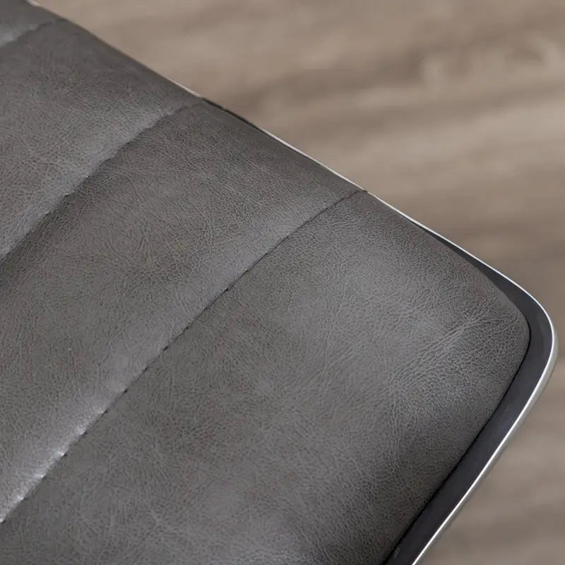 Chaise de bureau sans accoudoirs design côtelée en similicuir gris avec dossier mi-haut et pivotante